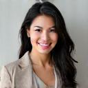 Portrait of Sarah Chen, a radiant woman in her 30s smiling confidently.